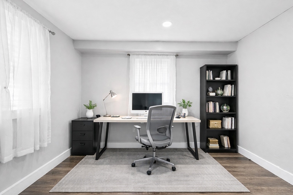 137 Westboro Road Grafton, MA 01536 - Photo 26 of 28 a view of a workspace with a bookshelf