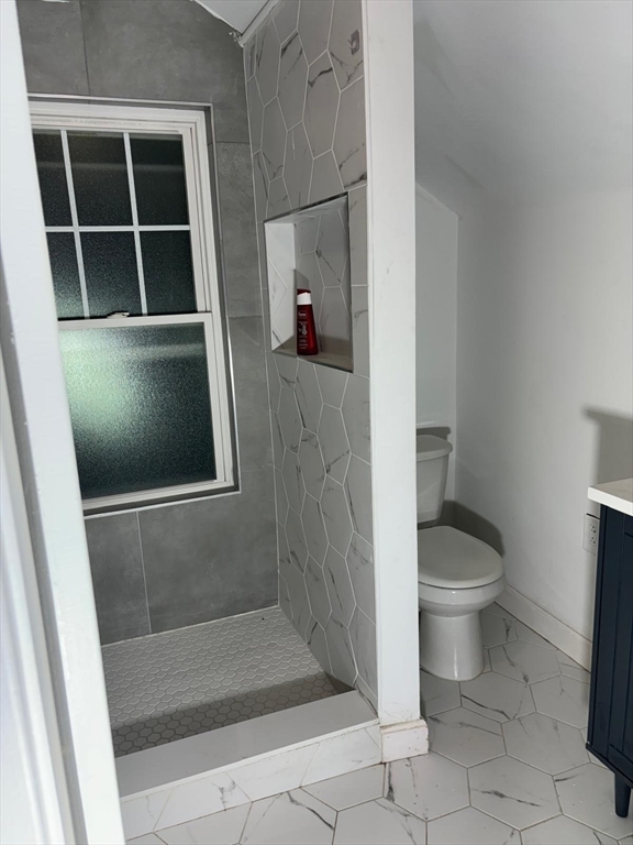137 Westboro Road Grafton, MA 01536 - Photo 8 of 28 a bathroom with a toilet and a shower