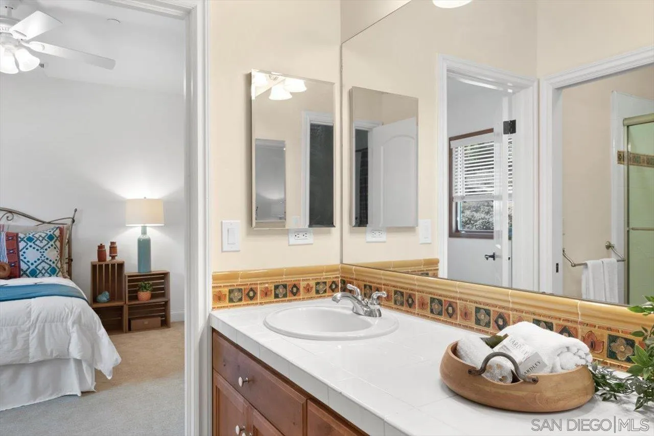 11760 Betsworth Road Valley Center, CA 92082 - Photo 19 of 47 a bathroom with a sink and a mirror