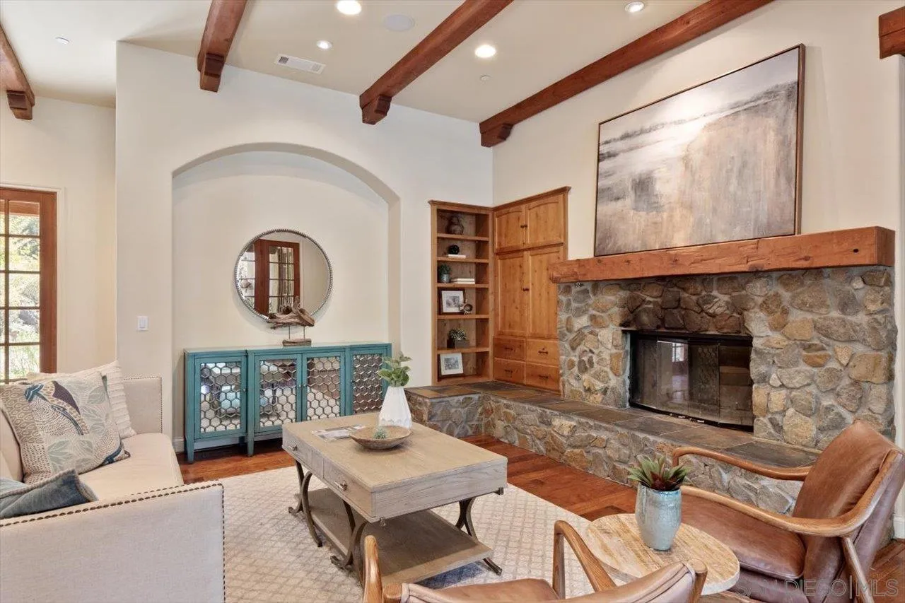11760 Betsworth Road Valley Center, CA 92082 - Photo 2 of 47 a living room with furniture a fireplace with wooden floor