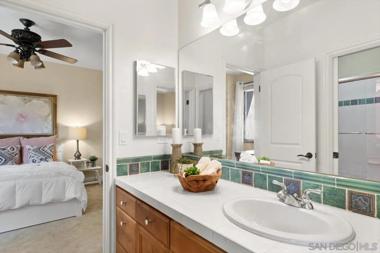 11760 Betsworth Road Valley Center, CA 92082 - Photo 23 of 47 a bathroom with a double vanity sink mirror and vanity