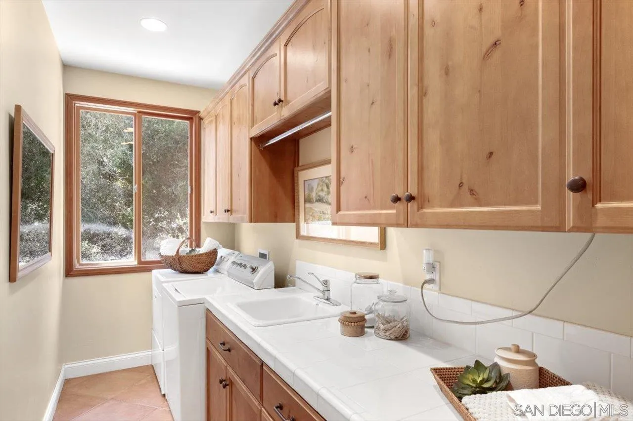 11760 Betsworth Road Valley Center, CA 92082 - Photo 25 of 47 a bathroom with a sink and a mirror