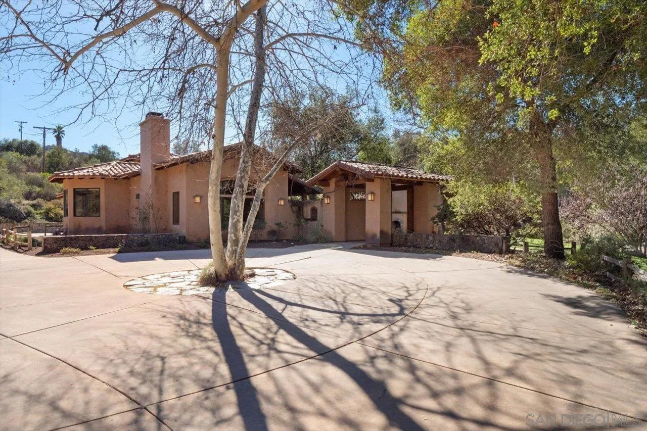 11760 Betsworth Road Valley Center, CA 92082 - Photo 35 of 47 a front view of a house with a yard and garage