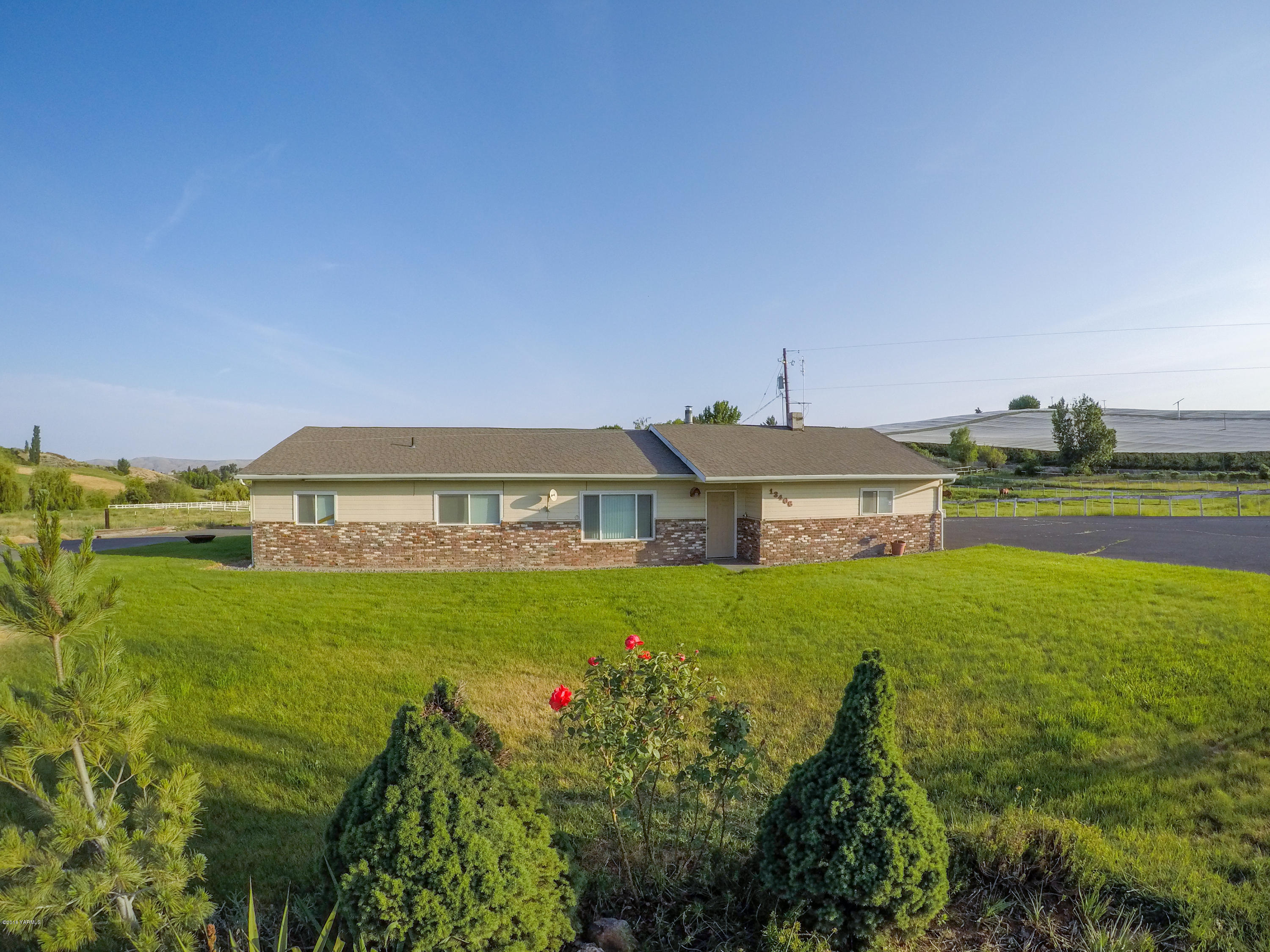 13406 Summitview Ext Road Yakima, WA 98908 - Photo 1 of 26 a view of a big house with a big yard and large trees