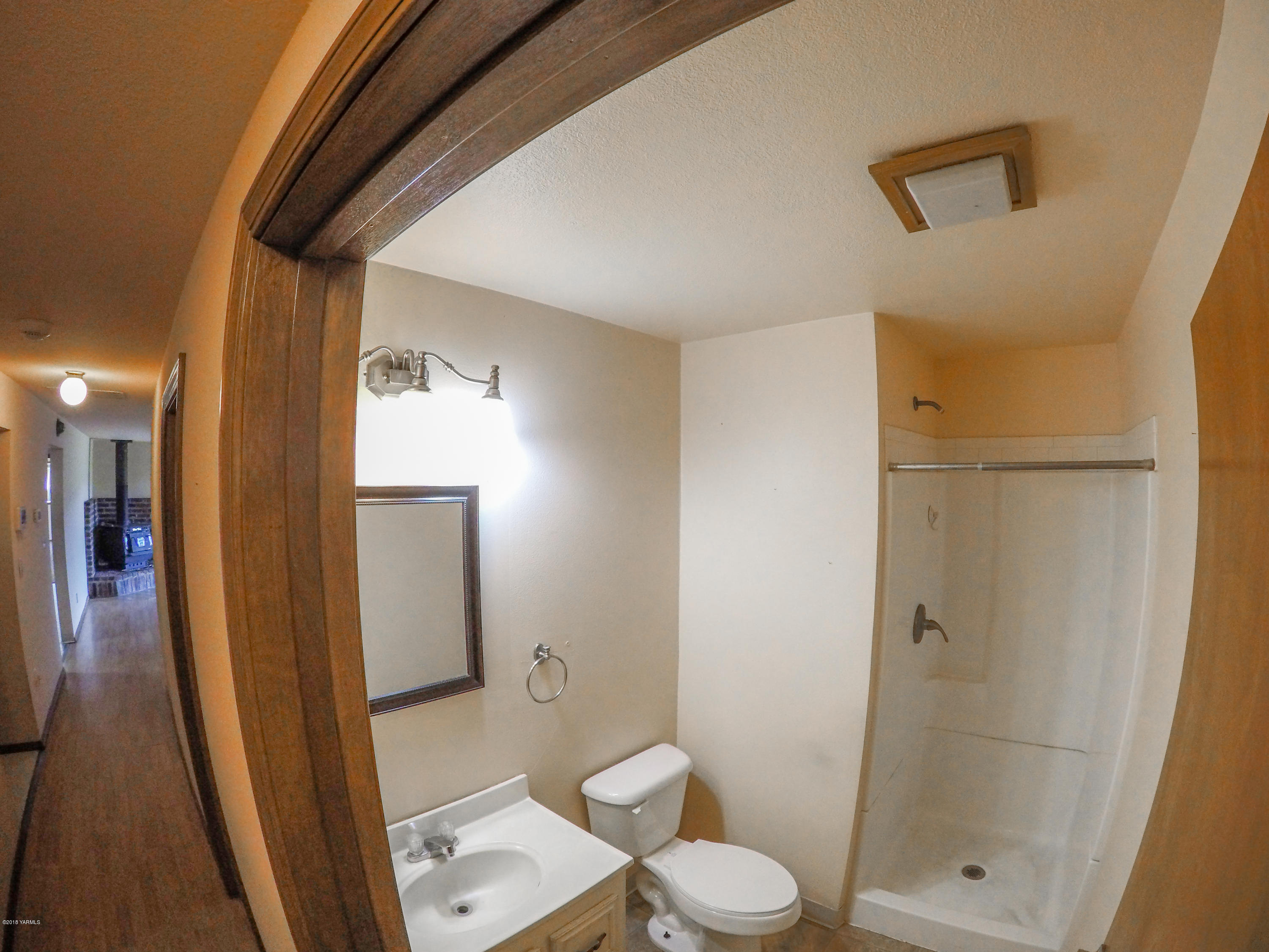13406 Summitview Ext Road Yakima, WA 98908 - Photo 16 of 26 a bathroom with a toilet a sink and shower