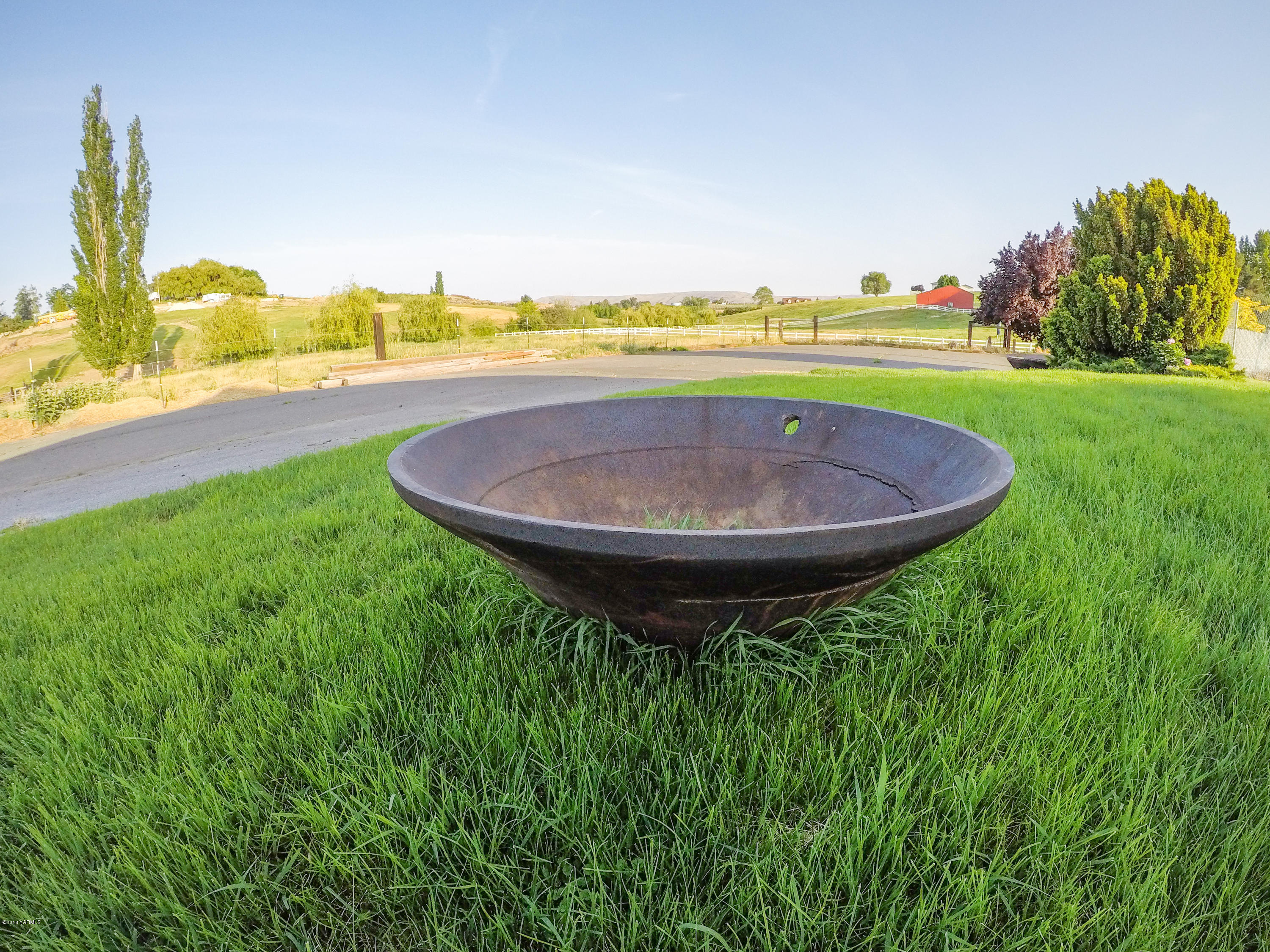 13406 Summitview Ext Road Yakima, WA 98908 - Photo 24 of 26 a view of a swimming pool with a garden and trees