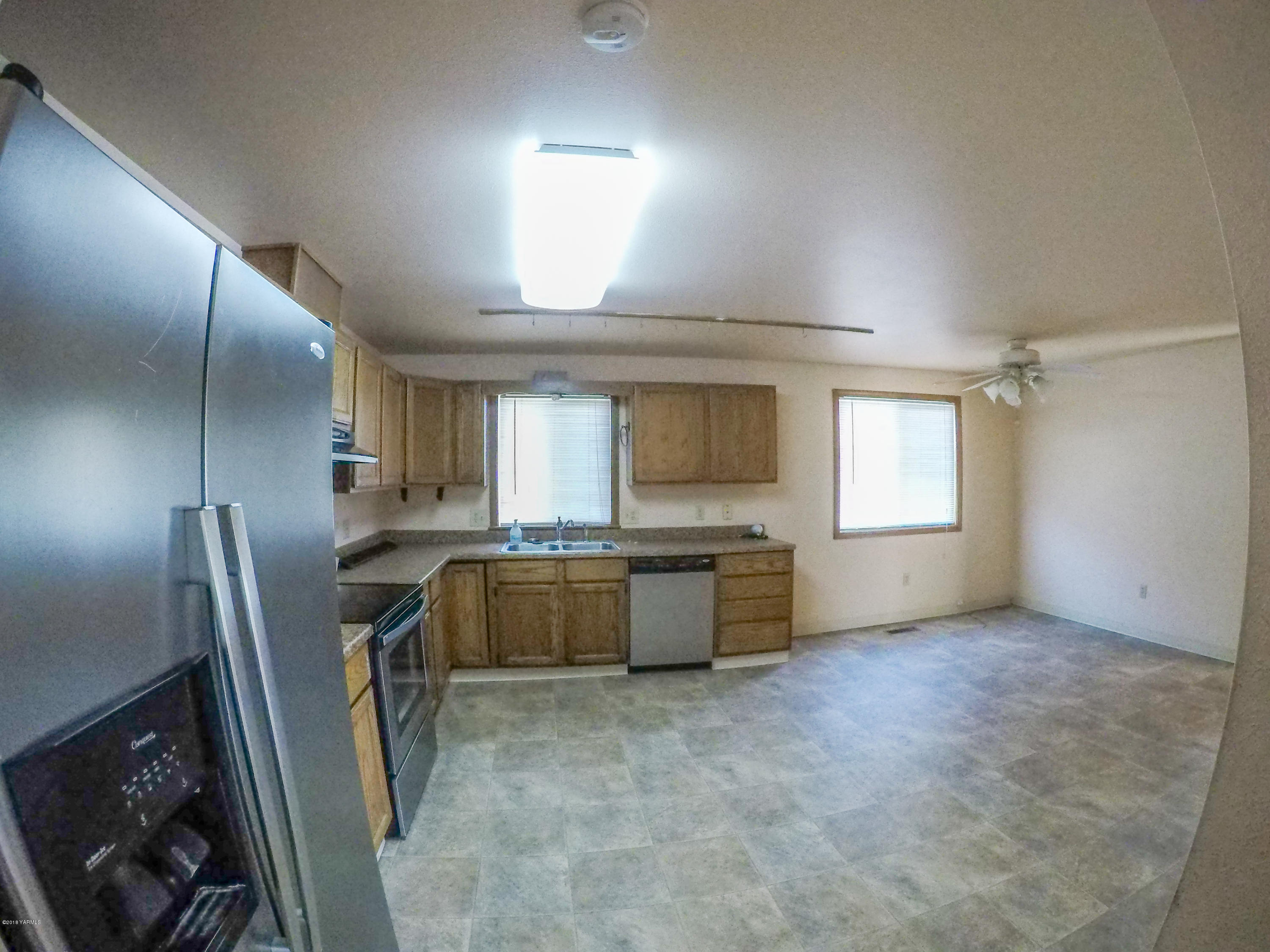 13406 Summitview Ext Road Yakima, WA 98908 - Photo 9 of 26 a view of a kitchen with refrigerator and window