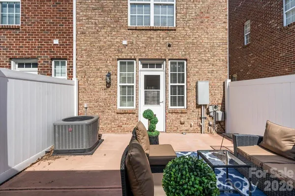 a view of a patio with chair and tables