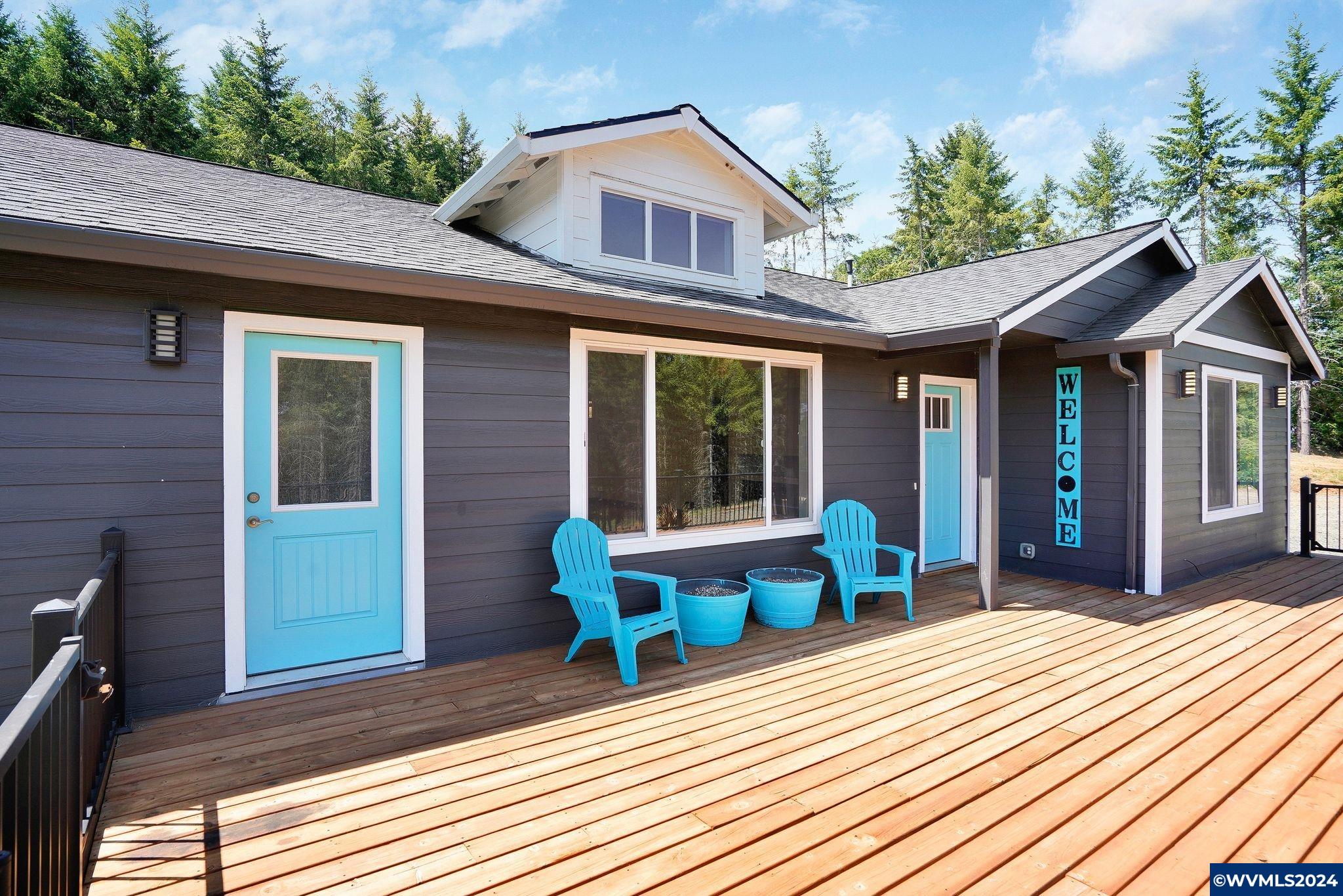 16480 Oakdale Road Dallas, OR 97338 - Photo 5 of 42 a view of a house with table and chairs in patio