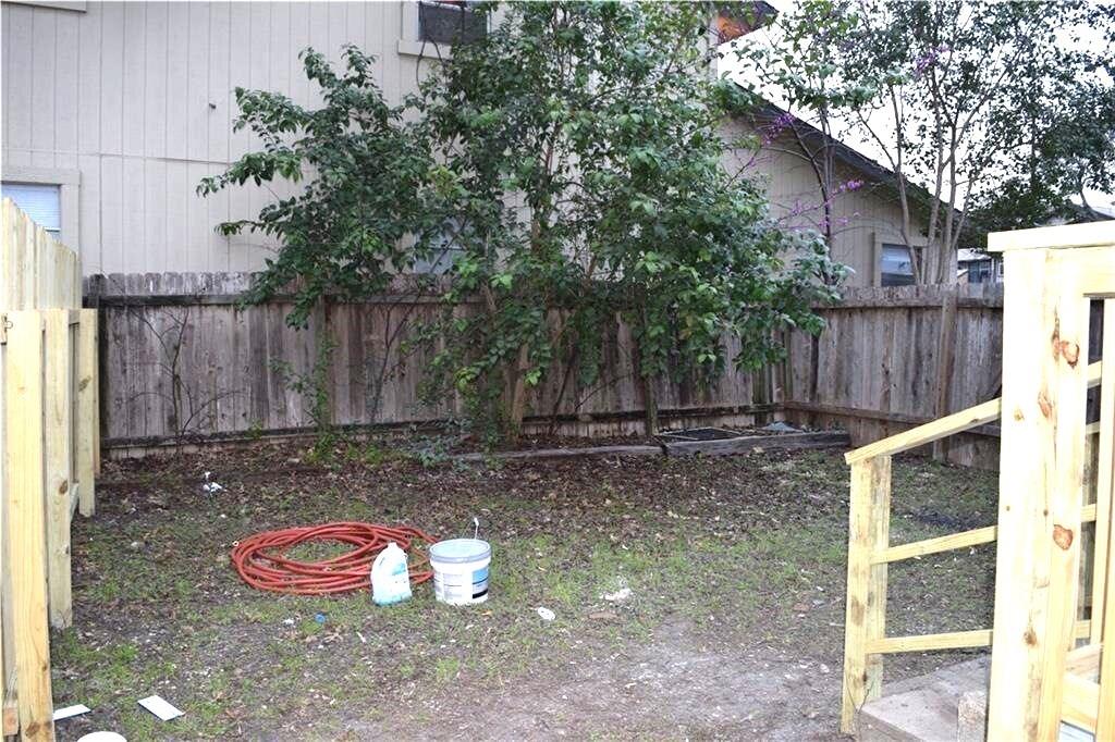 611 Nelray Boulevard, Unit B Austin, TX 78751 - Photo 8 of 11 a view of a backyard with small cabin