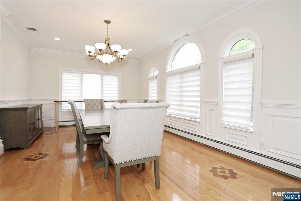 65 Ross Avenue Demarest, NJ 07627 - Photo 6 of 48 a view of a dining room with furniture and a chandelier