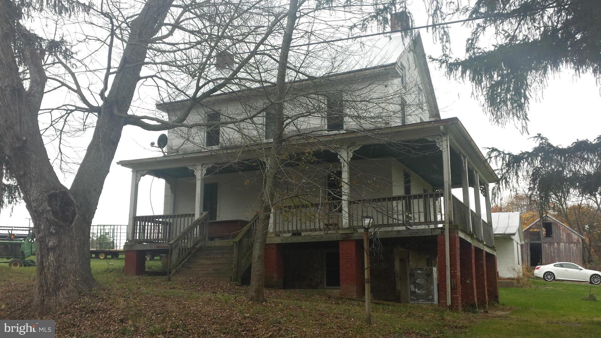 4022 Millers Station Road Manchester, MD 21102 - Photo 1 of 5 a view of a house with a large tree