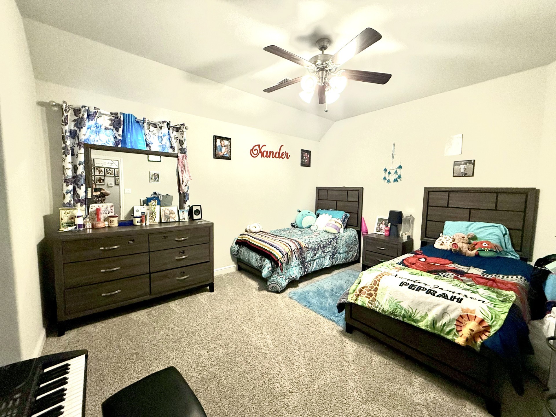 4811 Lacebark Pne Trail Rosenberg, TX 77471 - Photo 20 of 31 a bedroom with two beds and a fireplace