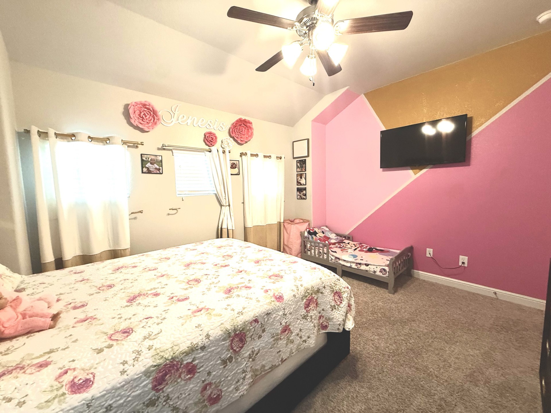 4811 Lacebark Pne Trail Rosenberg, TX 77471 - Photo 23 of 31 a bedroom with a bed dresser and a chandelier