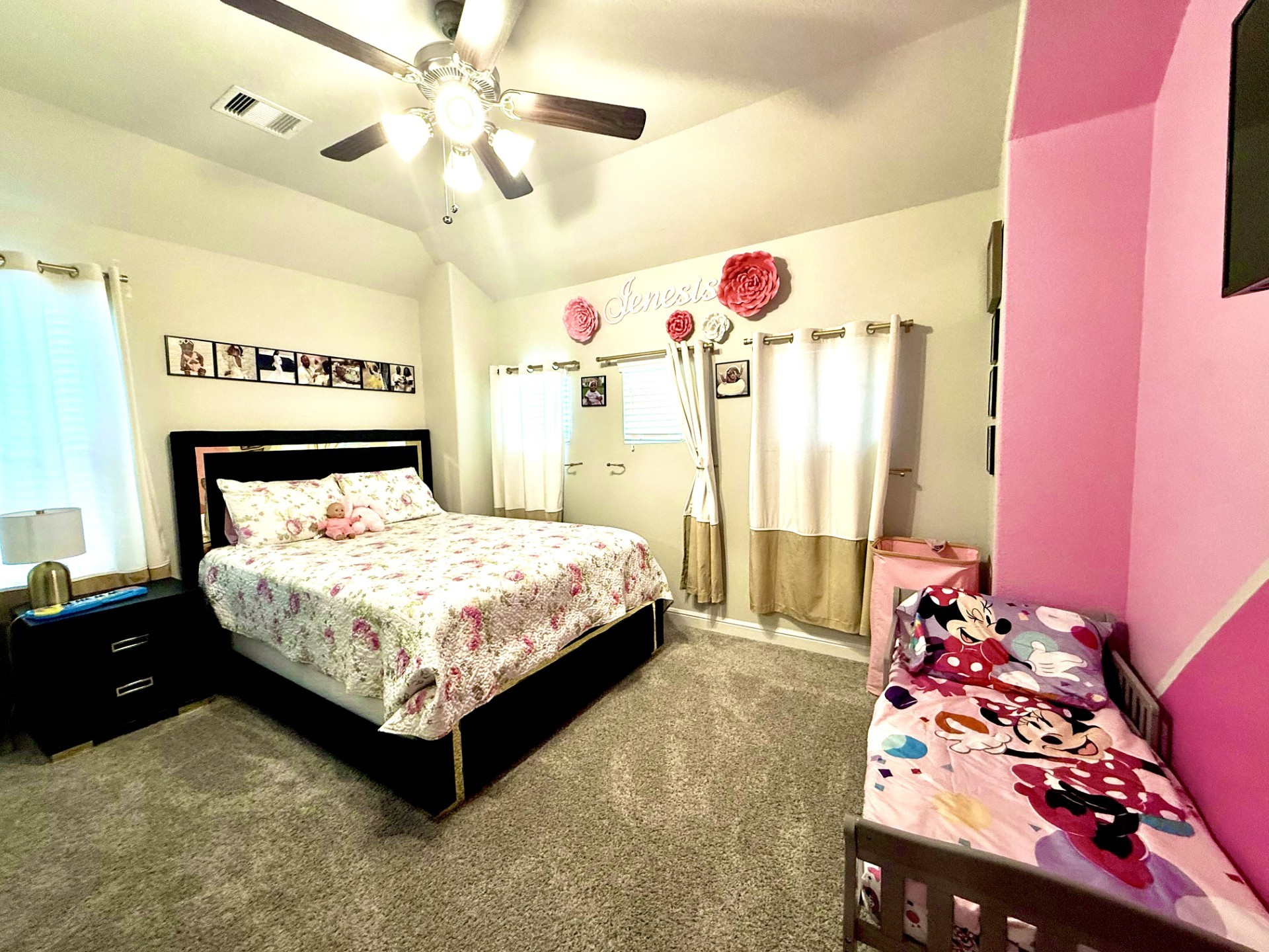 4811 Lacebark Pne Trail Rosenberg, TX 77471 - Photo 24 of 31 a bedroom with a bed and a chandelier