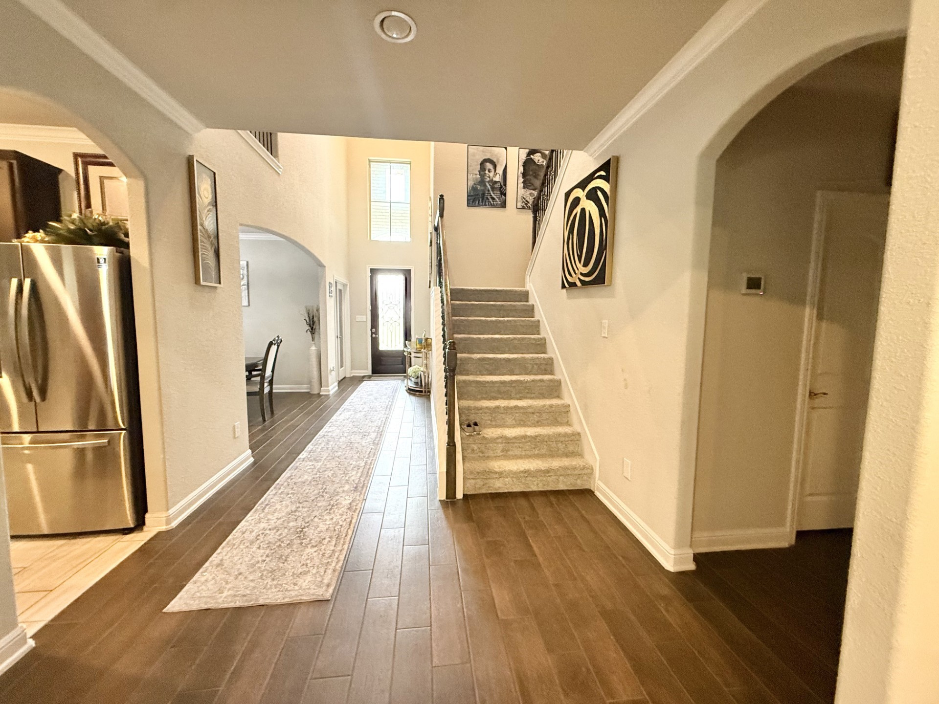 4811 Lacebark Pne Trail Rosenberg, TX 77471 - Photo 5 of 31 a view of a hallway with wooden floor and staircase