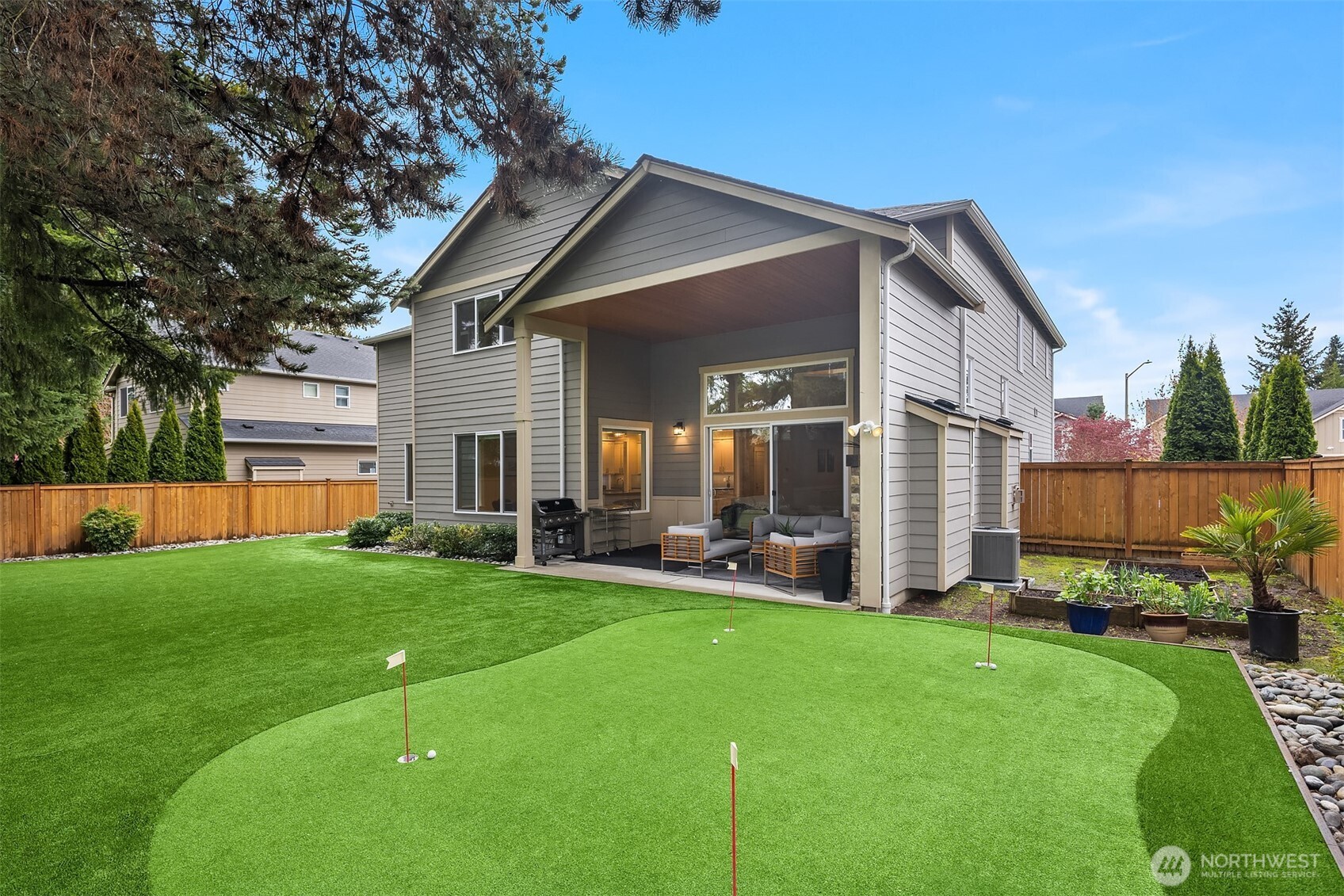 1435 242nd Place Southeast Bothell, WA 98021 - Photo 7 of 40 a view of a house with a yard and sitting area