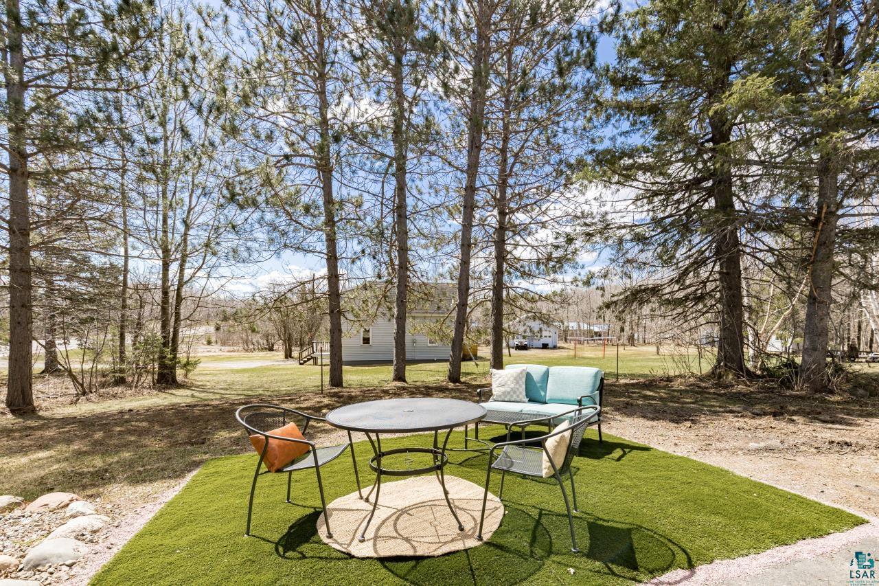 3645 Haines Road Hermantown, MN 55811 - Photo 15 of 35 Outdoor patio area featuring artificial turf