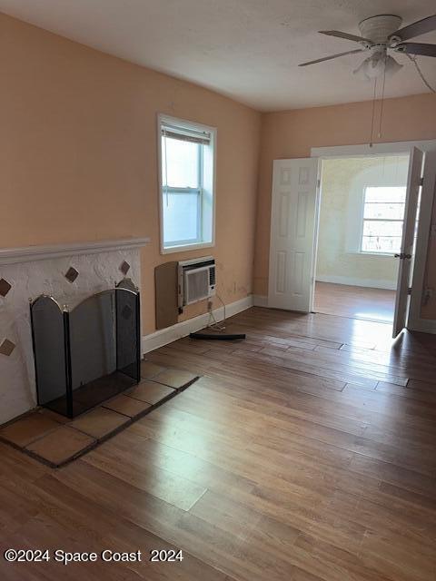 1219 East Strawbridge Avenue, Unit 4 Melbourne, FL 32901 - Photo 3 of 9 a view of a kitchen with furniture and wooden floor
