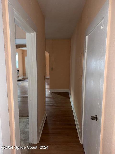 1219 East Strawbridge Avenue, Unit 4 Melbourne, FL 32901 - Photo 5 of 9 a view of a hallway with wooden floor