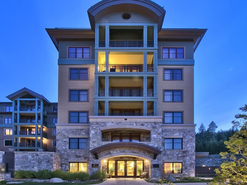 a front view of a building with many windows