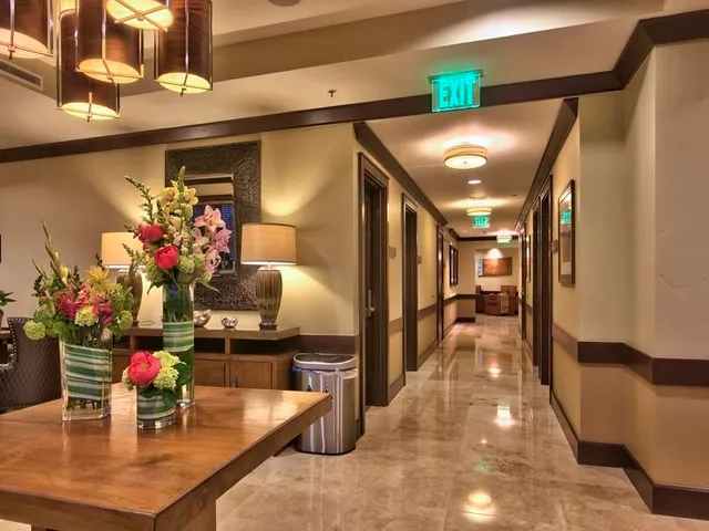 a view of a patio with chairs and table on the patio