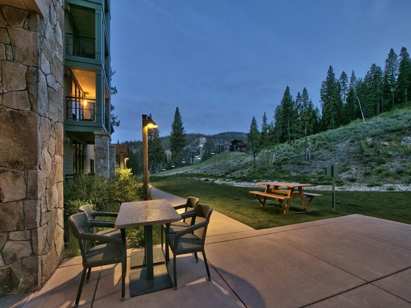 13051 Ritz Carlton Highlands Court, Unit 4308 INTEREST 8 Truckee, CA 96161 - Photo 16 of 26 a view of a patio with chairs and table on the patio