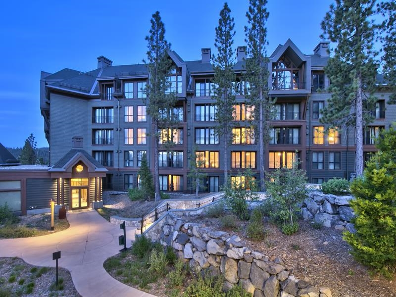 13051 Ritz Carlton Highlands Court, Unit 4308 INTEREST 8 Truckee, CA 96161 - Photo 20 of 26 a front view of a residential apartment building with a yard