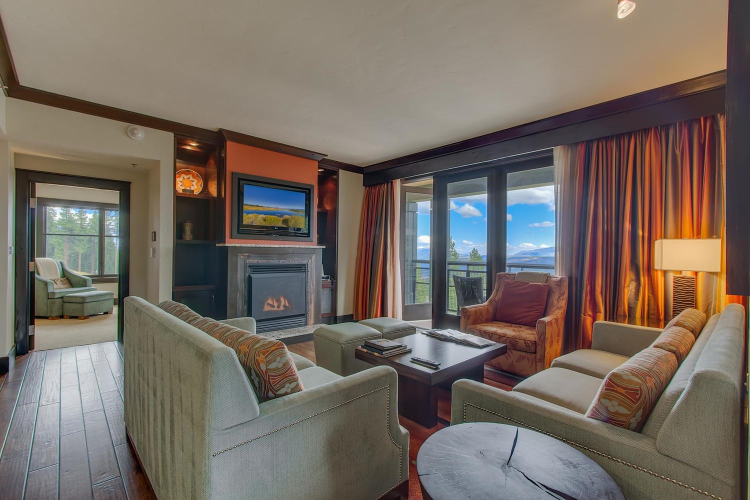 13051 Ritz Carlton Highlands Court, Unit 4308 INTEREST 8 Truckee, CA 96161 - Photo 2 of 26 a living room with furniture large window and wooden floor