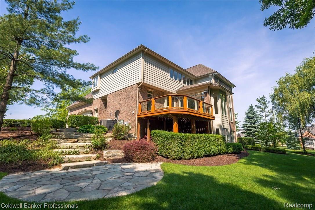 5329 Keswick Court Rochester, MI 48306 - Photo 61 of 64 Large deck with glass panels off of main level garden room!