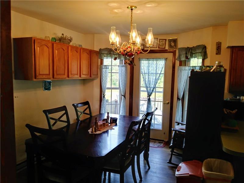 105 Elliott Road Grove City, PA 16127 - Photo 6 of 20 Dining Area has additional oak cabinets for extra storage, and a custom-built bump-out windows with French Door to exterior deck