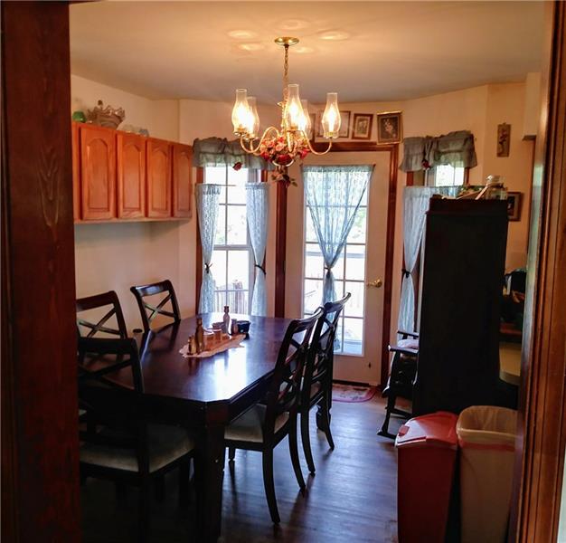 105 Elliott Road Grove City, PA 16127 - Photo 7 of 20 Dining Area has additional oak cabinets for extra storage, and a custom-built bump-out windows with French Door to exterior deck