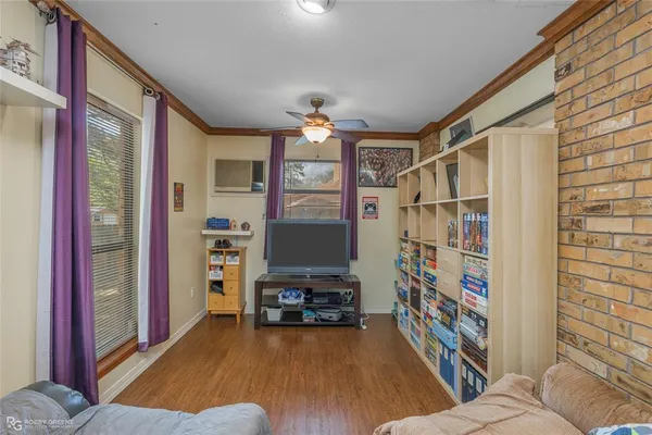 a bedroom with furniture and a book shelf
