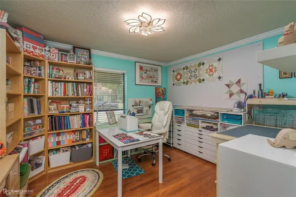 a living room with furniture and a book shelf