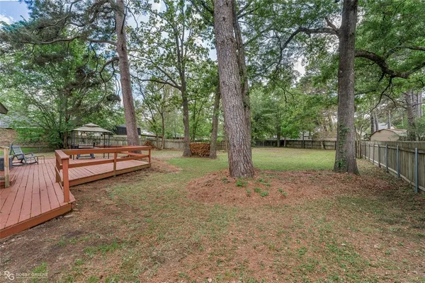 a backyard of a house with lots of green space