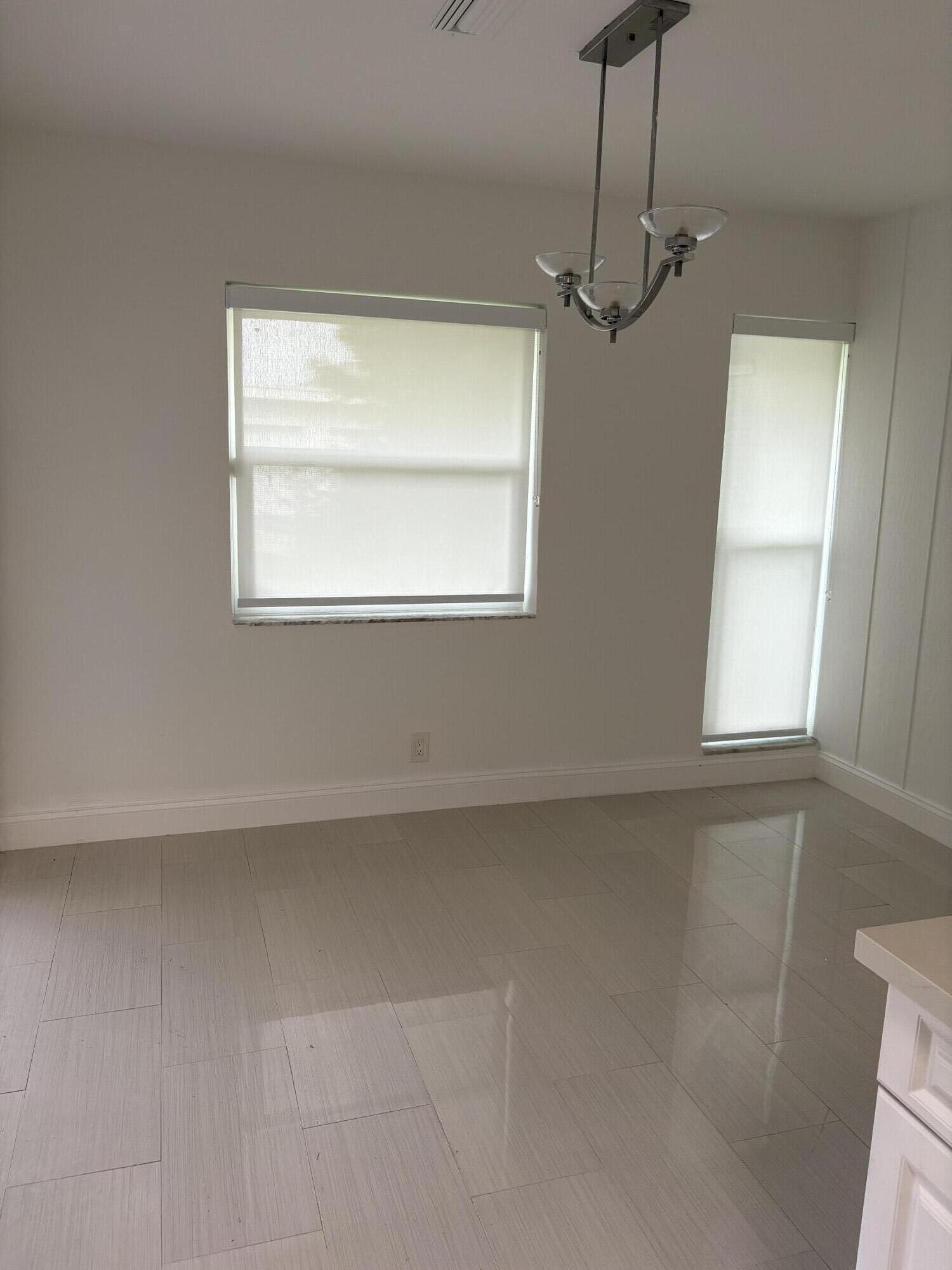5904 Cedar Circle Tamarac, FL 33319 - Photo 9 of 23 a view of empty room with window