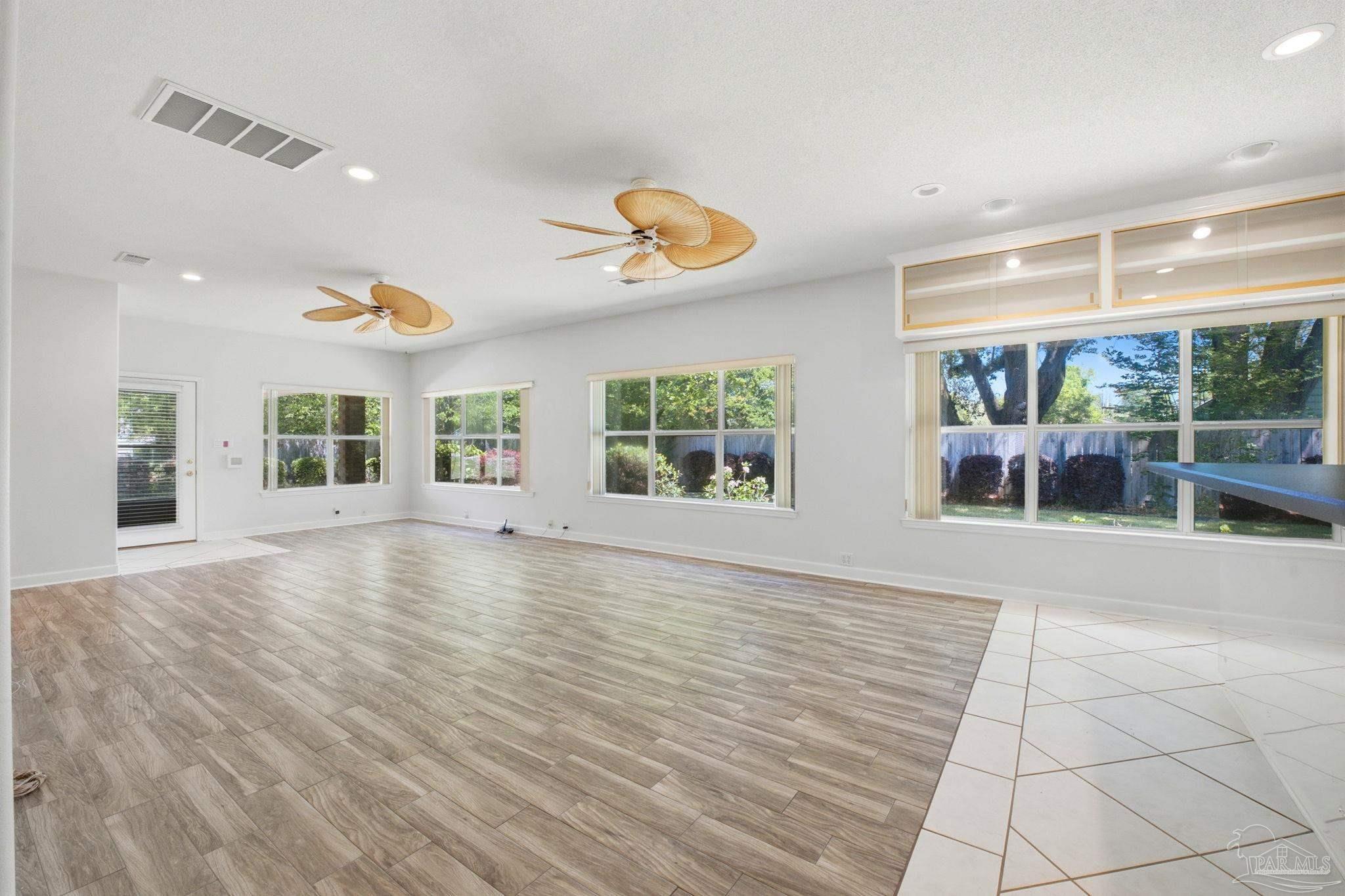 4552 Peaden Road Pace, FL 32571 - Photo 14 of 38 an empty room with windows and entrance