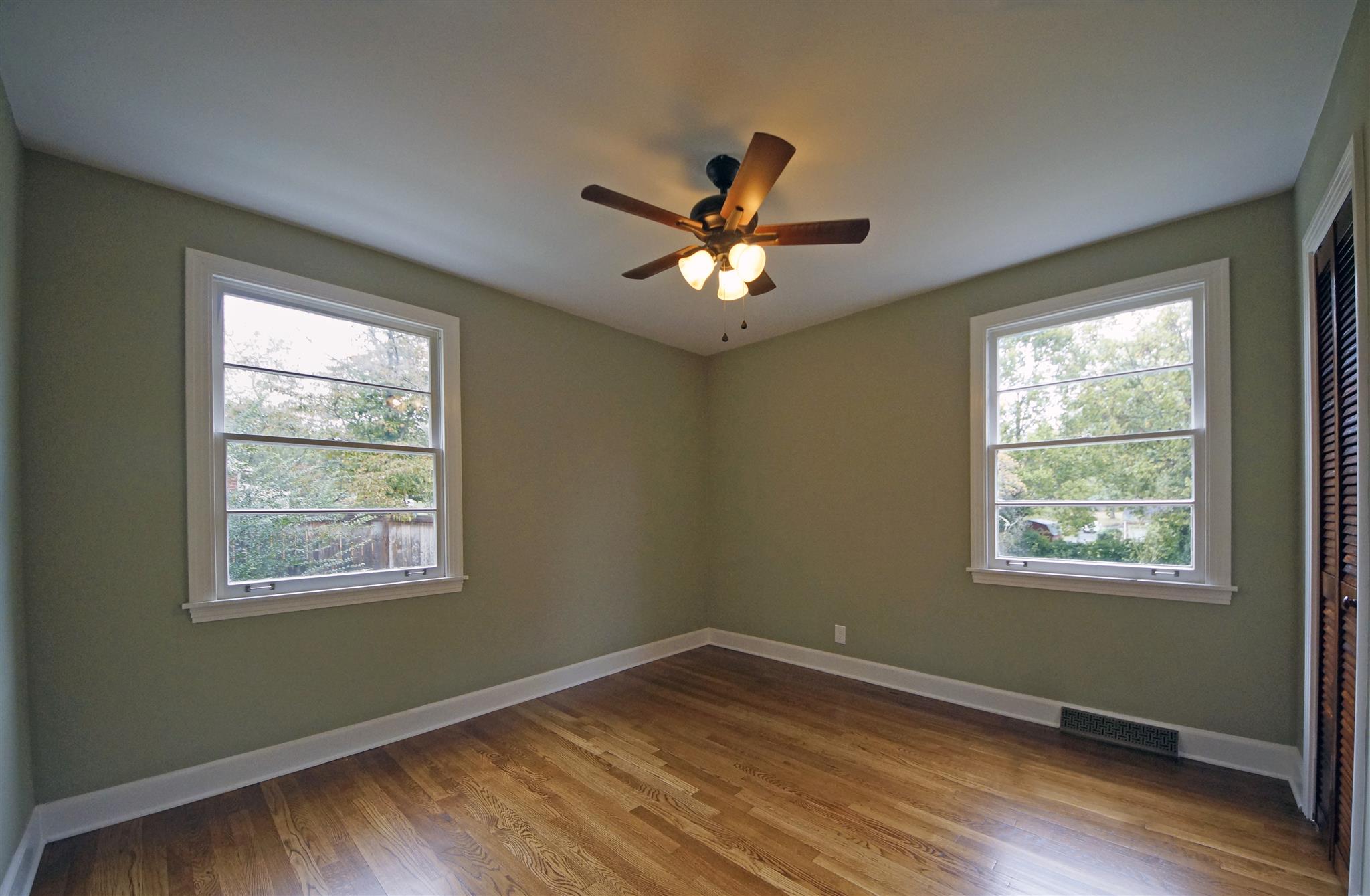 807 River Pass Madison, TN 37115 - Photo 11 of 25 a view of an empty room with wooden floor and a window