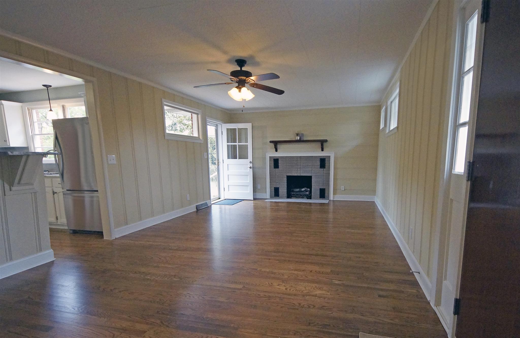 807 River Pass Madison, TN 37115 - Photo 15 of 25 wooden floor in an empty room with a fireplace