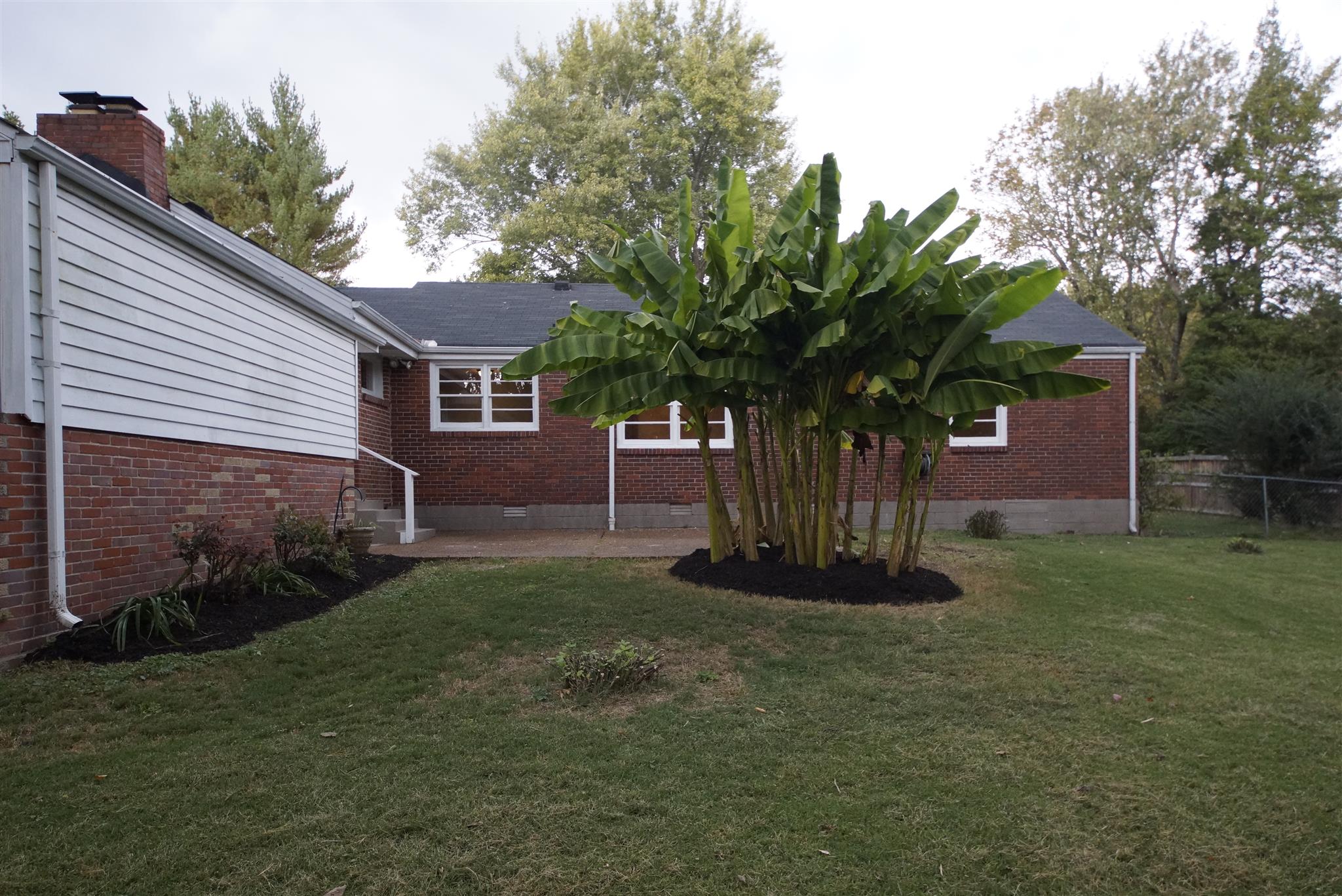 807 River Pass Madison, TN 37115 - Photo 22 of 25 a front view of a house with a garden