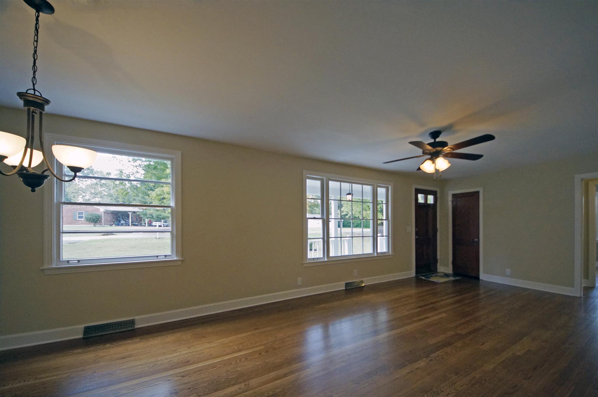 807 River Pass Madison, TN 37115 - Photo 6 of 25 a view of an empty room with wooden floor and a window