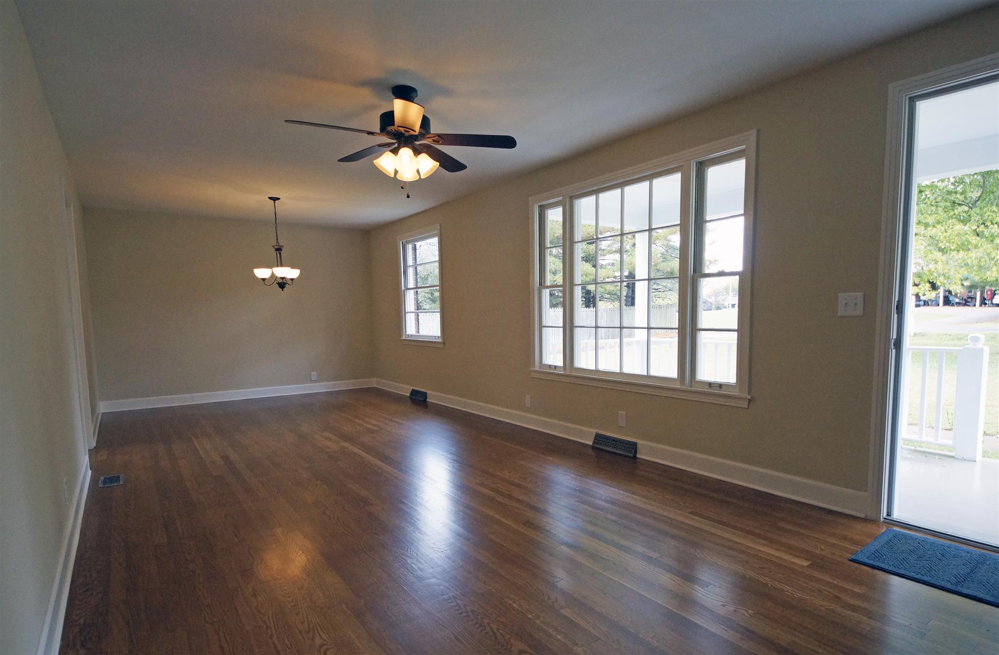 807 River Pass Madison, TN 37115 - Photo 7 of 25 a view of an empty room with wooden floor and a window