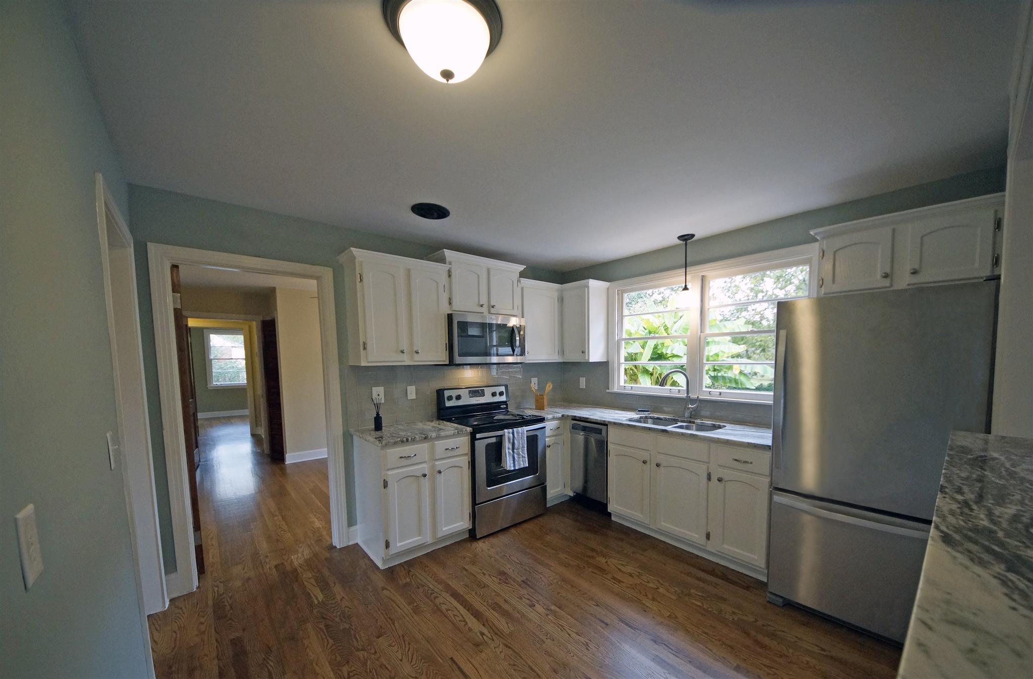 807 River Pass Madison, TN 37115 - Photo 9 of 25 a kitchen with stainless steel appliances granite countertop a sink stove and refrigerator