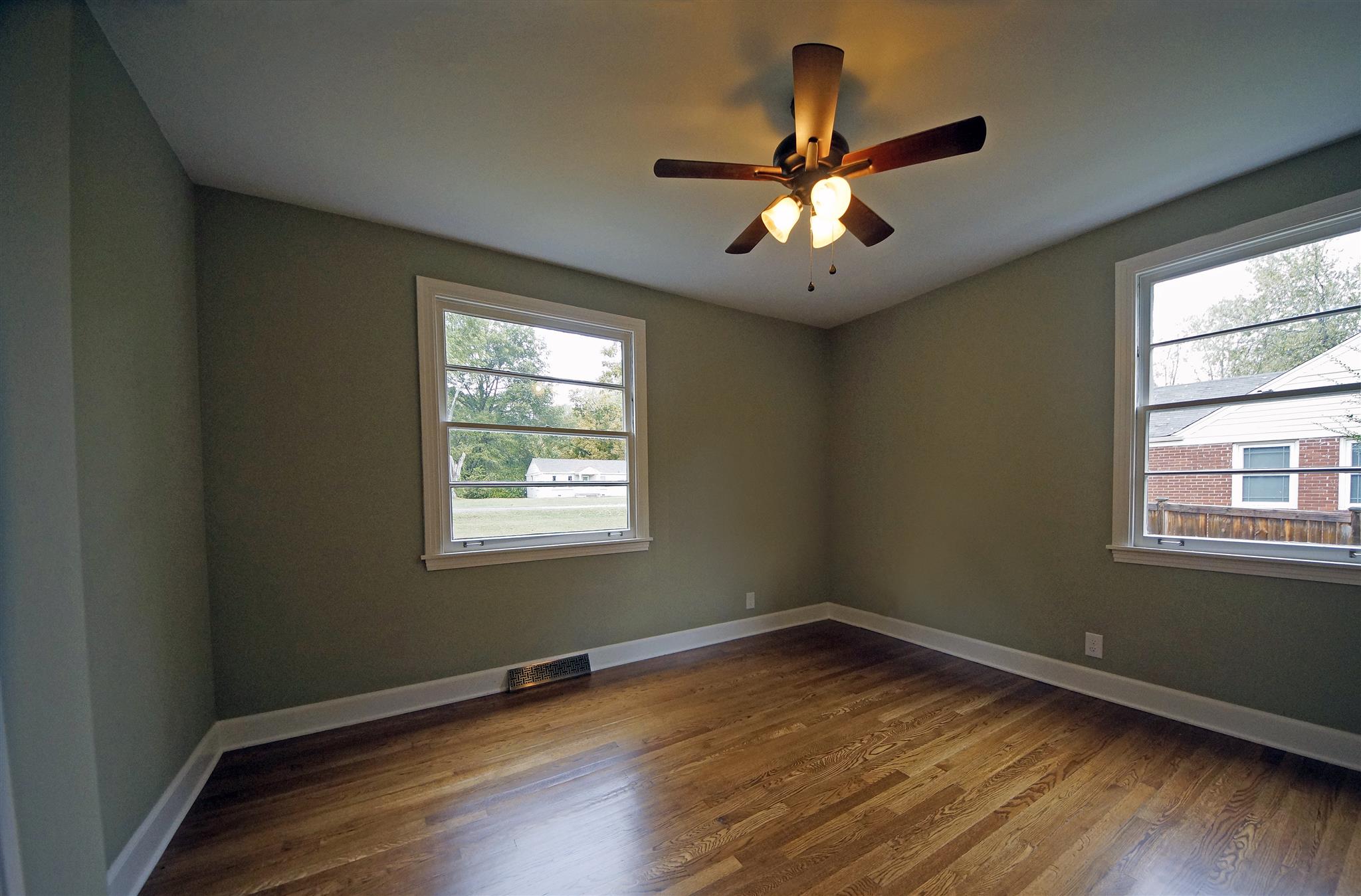 807 River Pass Madison, TN 37115 - Photo 10 of 25 a view of an empty room with wooden floor and a window