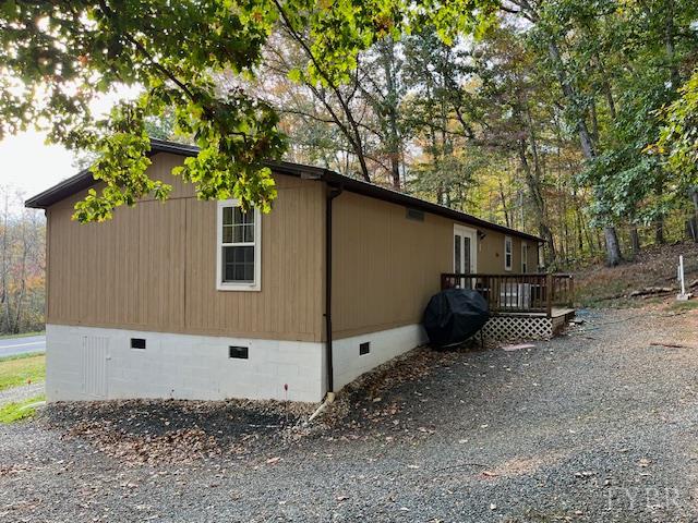 1225 Riverville Road Gladstone, VA 24553 - Photo 3 of 11 a backyard of a house with plants and tree