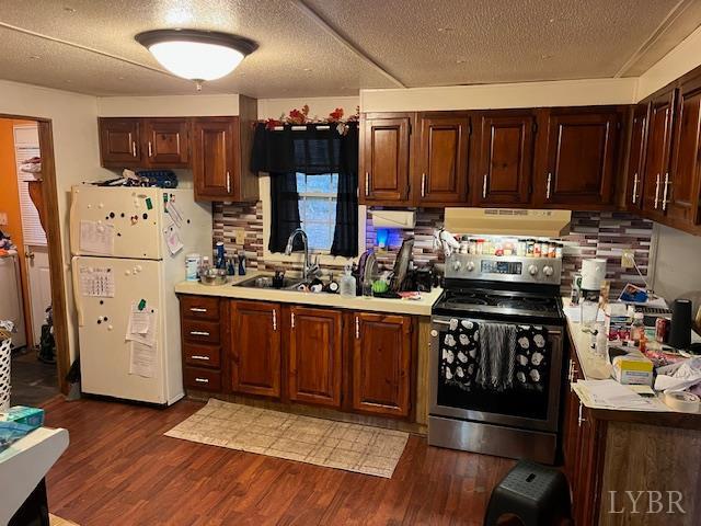 1225 Riverville Road Gladstone, VA 24553 - Photo 7 of 11 a kitchen with wooden cabinets and a stove top oven