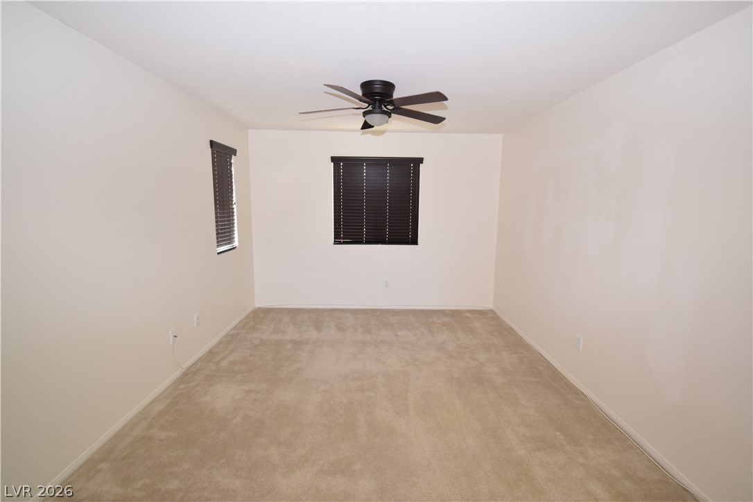 3622 Via Terracina Henderson, NV 89052 - Photo 12 of 22 Well-lit room with plush carpeting and natural illumination.