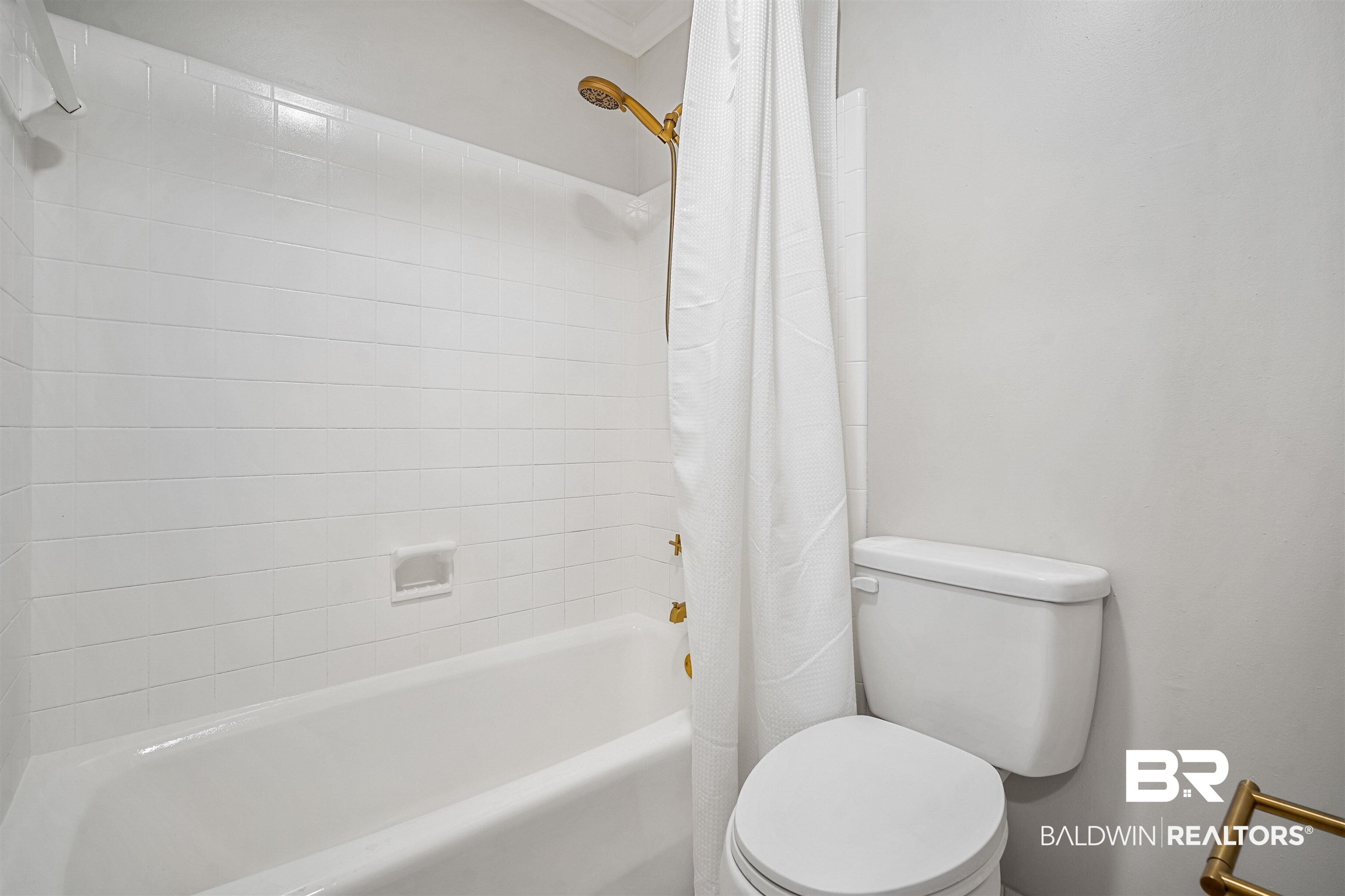 3050 Lacoste Road Mobile, AL 36618 - Photo 17 of 30 Full bathroom featuring shower / bath combo with shower curtain and ornamental molding