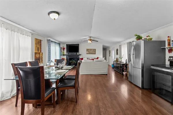 a living room with furniture fireplace and flat screen tv