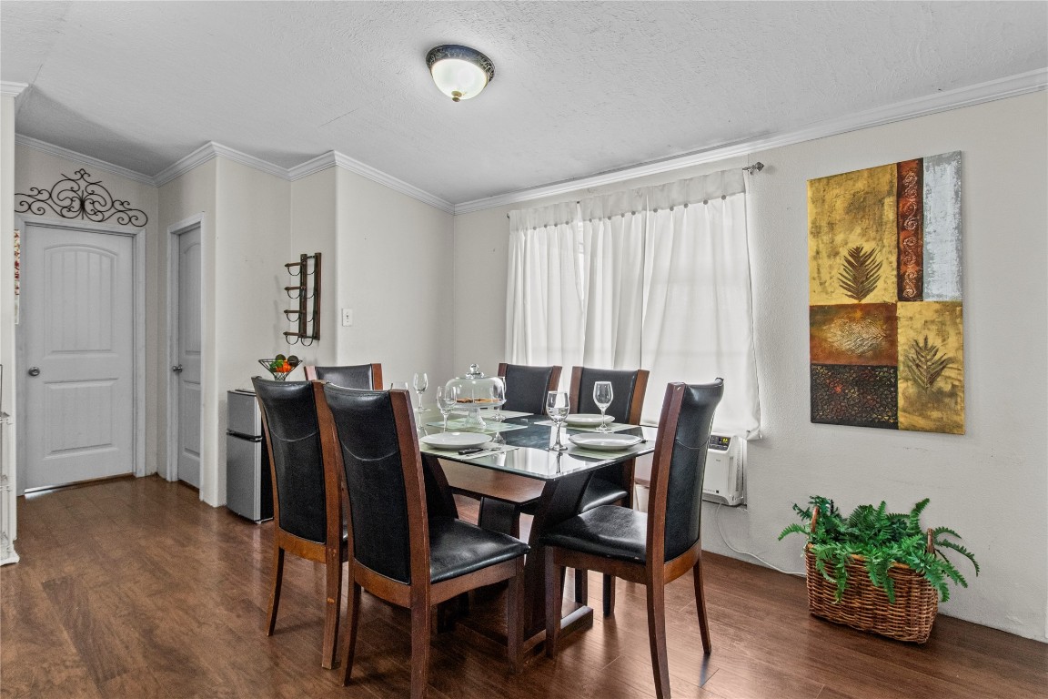 706 11th Street San Leon, TX 77539 - Photo 4 of 20 a view of a dining room with furniture and wooden floor